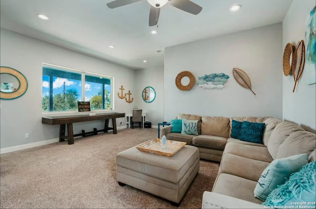 carpeted living area featuring a ceiling fan, recessed lighting, and baseboards