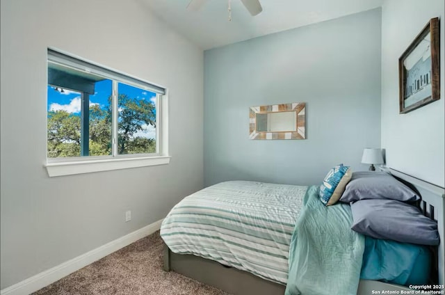 bedroom featuring ceiling fan, carpet, and baseboards