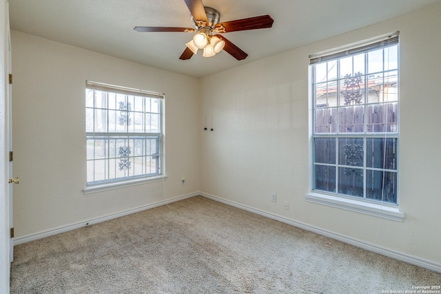 unfurnished room featuring ceiling fan, baseboards, and carpet flooring