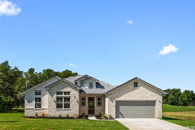 view of front of house with driveway, a front lawn, roof with shingles, and an attached garage