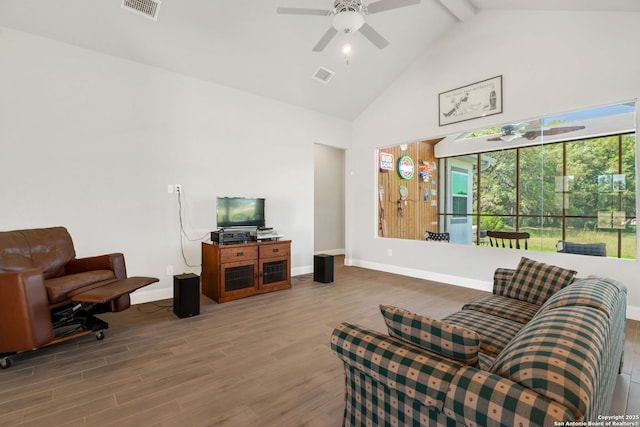 interior space featuring high vaulted ceiling, wood finished floors, and visible vents