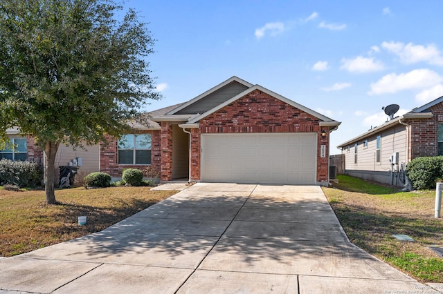 view of front of house with a garage, concrete driveway, central air condition unit, a front lawn, and brick siding