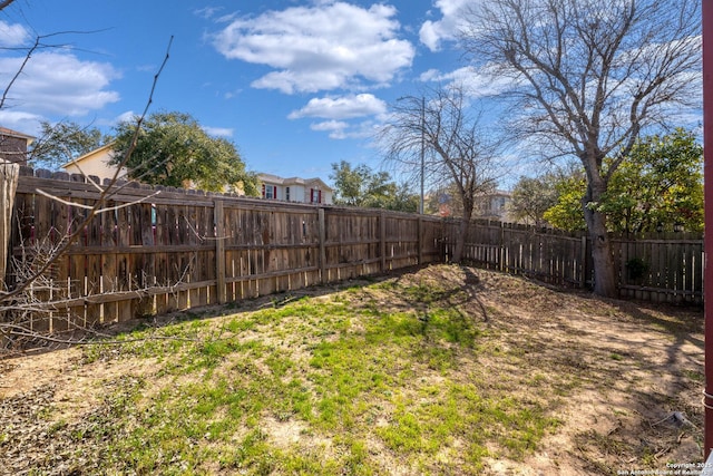 view of yard with a fenced backyard