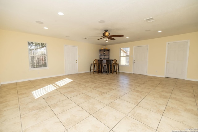 unfurnished room featuring recessed lighting, visible vents, baseboards, and light tile patterned floors