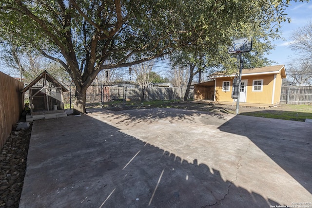 exterior space with a patio area and a fenced backyard