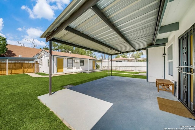 view of patio featuring an outbuilding and a fenced backyard