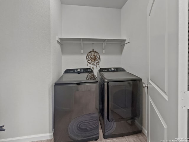 2832 Klein Way, New Braunfels, TX 78130 - laundry area featuring laundry area, baseboards, wood finished floors, and washing machine and clothes dryer