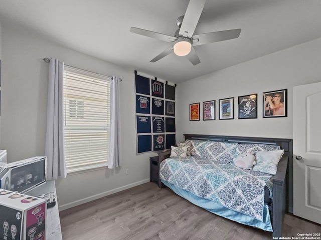 2832 Klein Way, New Braunfels, TX 78130 - bedroom featuring a ceiling fan, baseboards, and wood finished floors