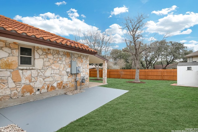 view of yard featuring a patio area and fence