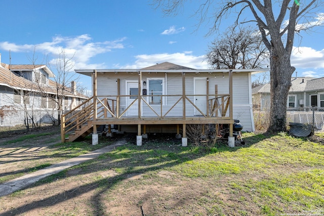 back of property featuring a yard, stairway, fence, and a wooden deck