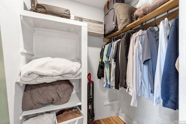 spacious closet featuring wood finished floors