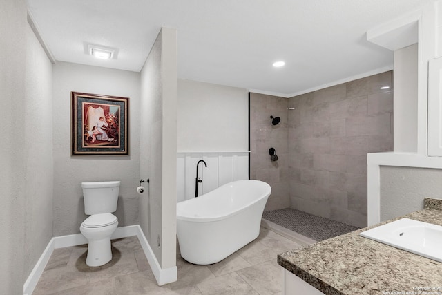 bathroom featuring a walk in shower, toilet, vanity, baseboards, and a soaking tub