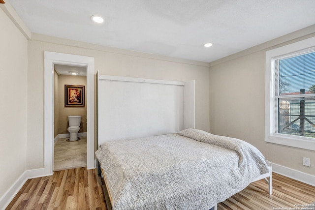 bedroom featuring recessed lighting, light wood-style flooring, and baseboards