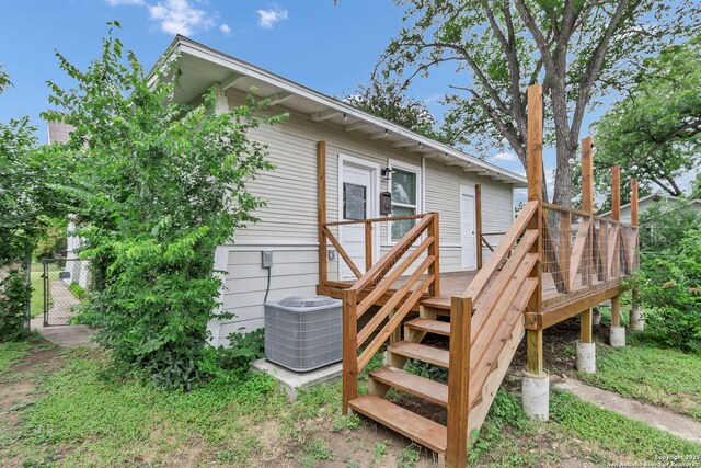 121 Harding, San Antonio, TX 78203 - rear view of house featuring central AC unit, a gate, a wooden deck, and stairs