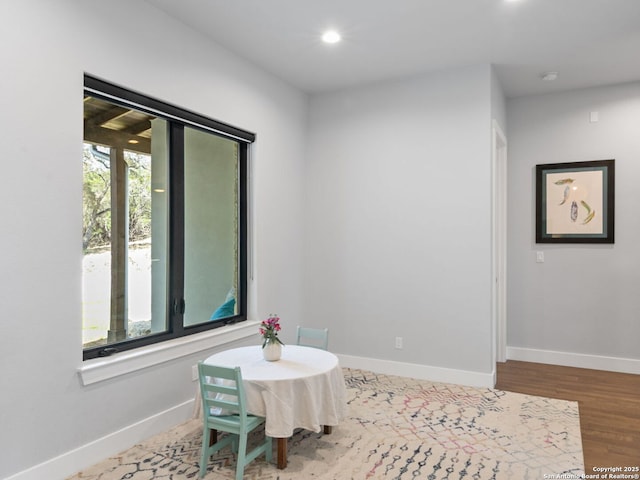 interior space featuring recessed lighting, wood finished floors, and baseboards