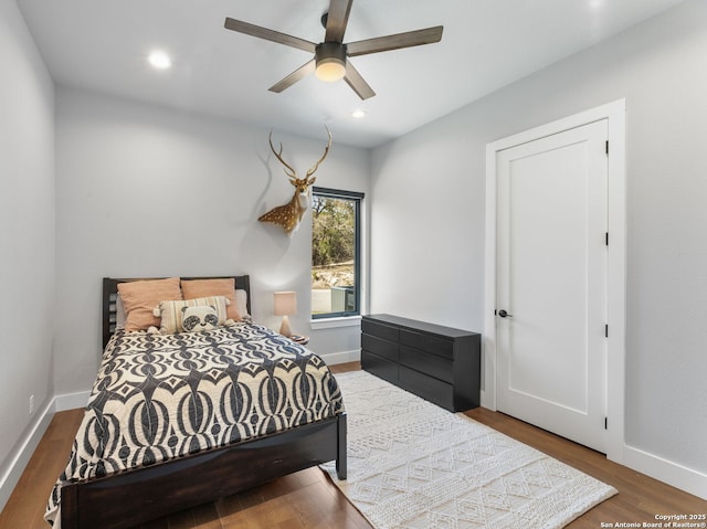 bedroom featuring recessed lighting, baseboards, and wood finished floors