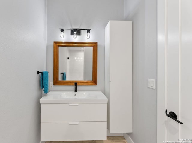 bathroom with a shower and vanity