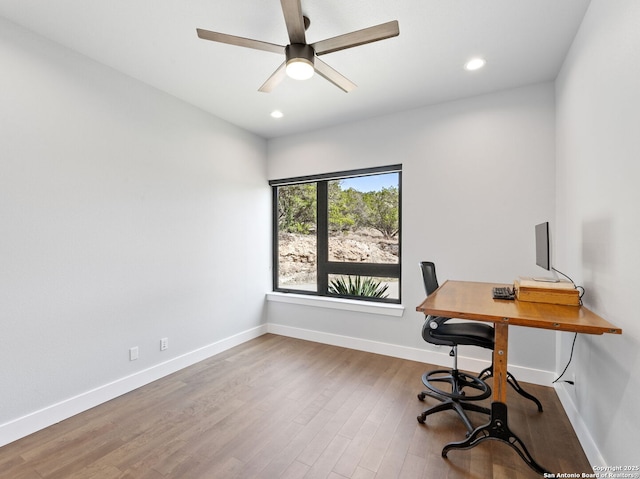 office space with recessed lighting, wood finished floors, and baseboards