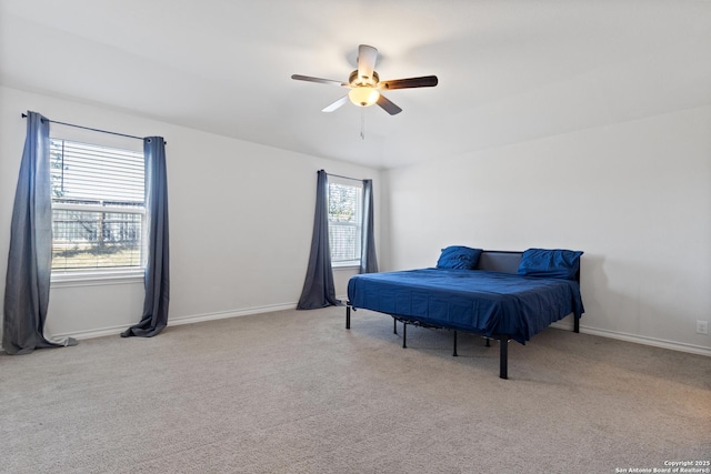 bedroom featuring a ceiling fan, baseboards, and carpet flooring