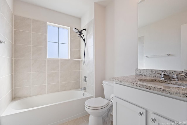 bathroom featuring toilet, tile patterned floors, washtub / shower combination, and vanity