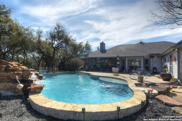 outdoor pool featuring a patio