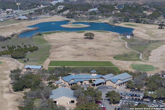 birds eye view of property featuring a water view and golf course view