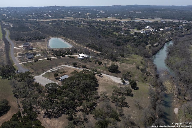 bird's eye view with a water view