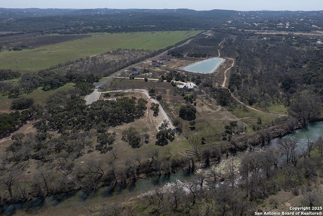 aerial view with a rural view and a water view