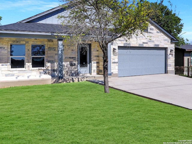 view of front of house with board and batten siding, a garage, stone siding, driveway, and a front lawn