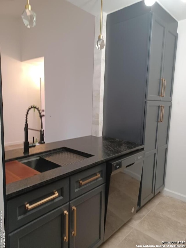 kitchen with black dishwasher, a sink, dark stone countertops, and light tile patterned floors