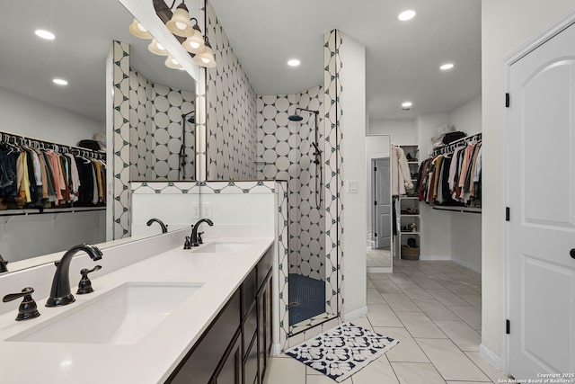 bathroom featuring a stall shower, a sink, and recessed lighting