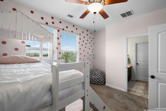 bedroom featuring visible vents, ceiling fan, light carpet, and baseboards