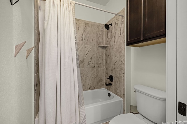 bathroom featuring toilet and shower / bath combo