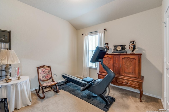 workout room with carpet, lofted ceiling, and baseboards