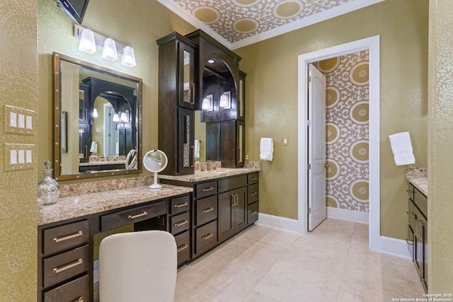 full bath with tile patterned flooring, vanity, and baseboards