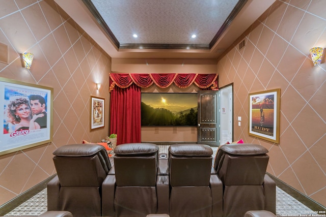 home theater room featuring recessed lighting, a raised ceiling, tile walls, and crown molding