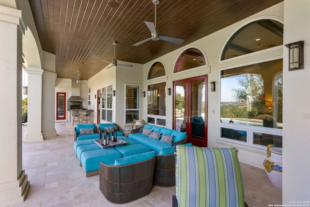 view of patio featuring outdoor dining area, ceiling fan, and outdoor lounge area