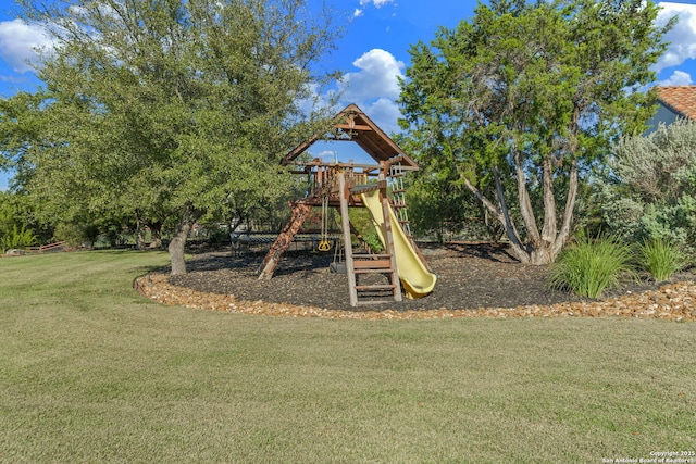 view of play area featuring a lawn