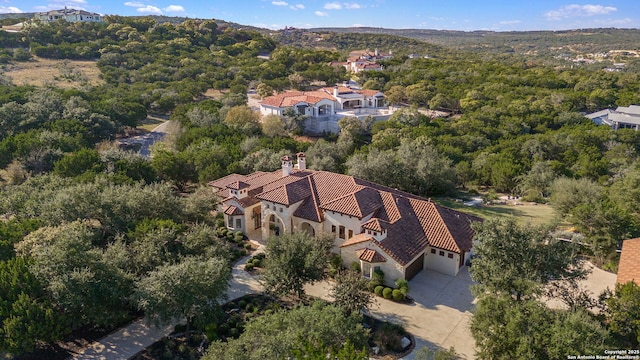 aerial view featuring a wooded view