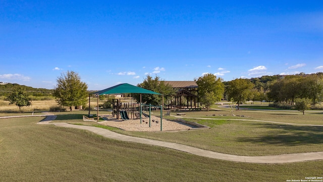 community play area with a lawn