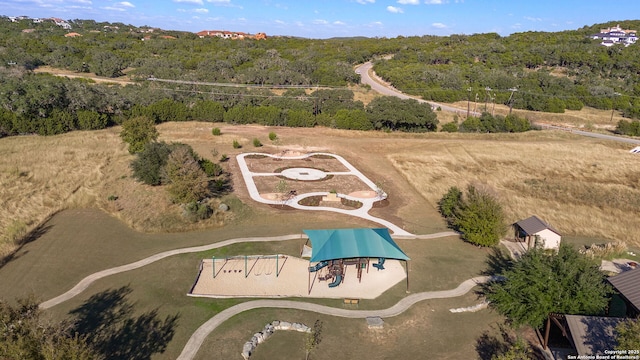 aerial view featuring a wooded view