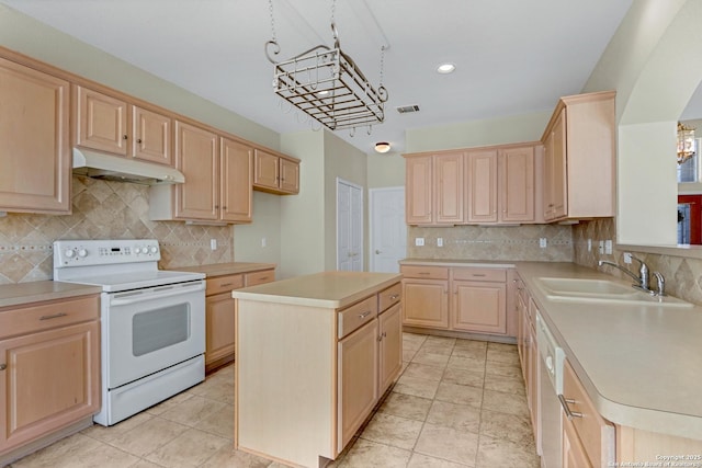 kitchen with white range with electric stovetop, light countertops, light brown cabinets, a sink, and under cabinet range hood