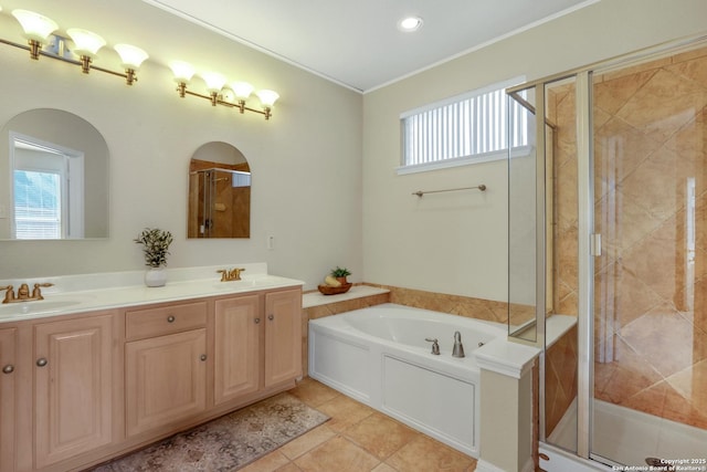 full bathroom with ornamental molding, a stall shower, a sink, and a bath