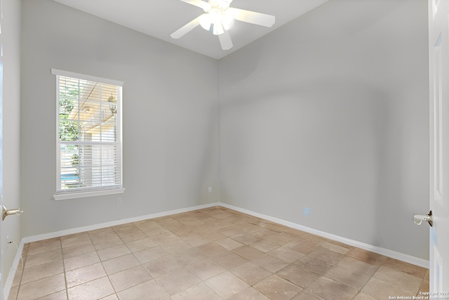 empty room with baseboards and a ceiling fan