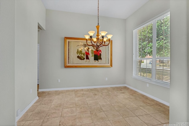 unfurnished room featuring baseboards, a chandelier, and light tile patterned flooring