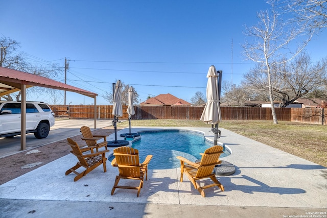 view of pool with a yard, a fenced backyard, a fenced in pool, and a patio