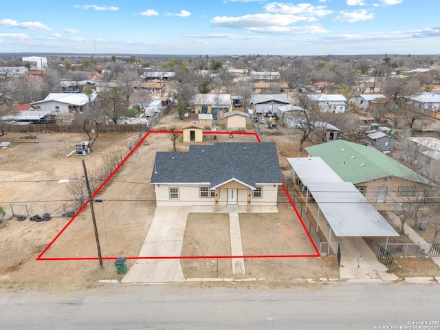 birds eye view of property with a residential view