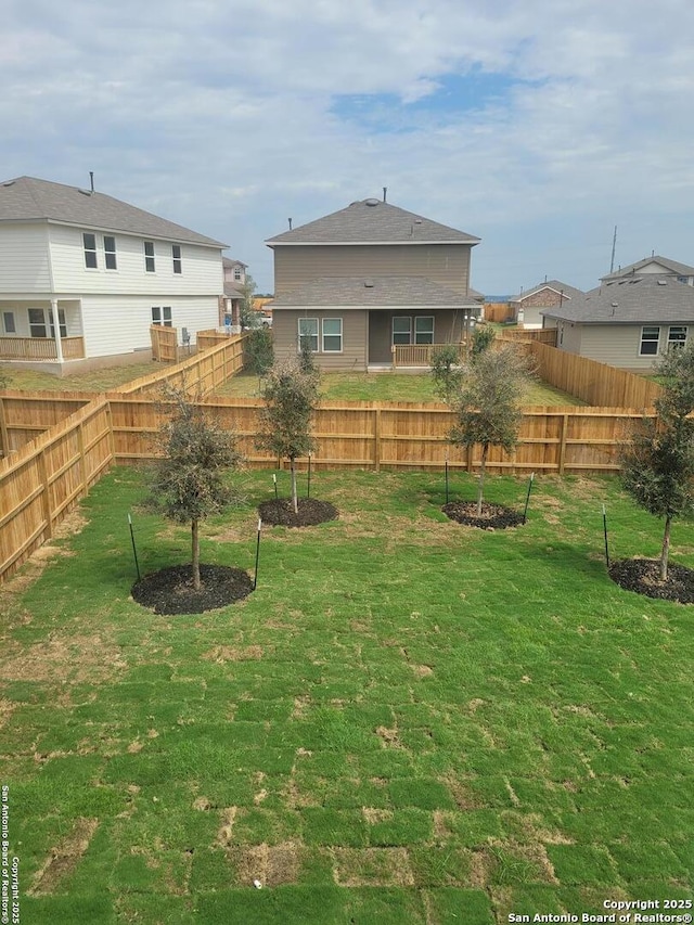 view of yard featuring a fenced backyard