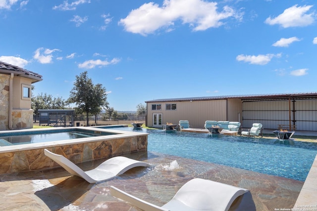 pool with fence, a patio, and an outbuilding