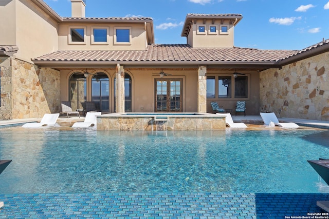 pool with a ceiling fan, french doors, a patio, and an in ground hot tub